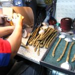 Michael Michaud polishing jewelry